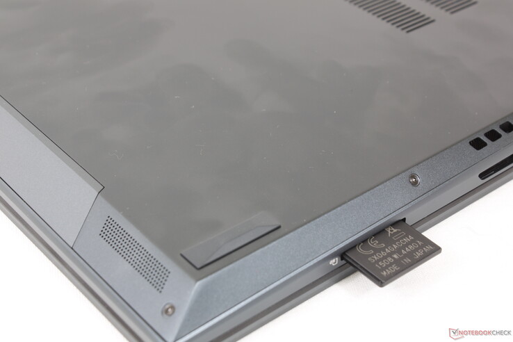 Fully inserted SD card still protrudes by over half its length. The reader is not spring loaded