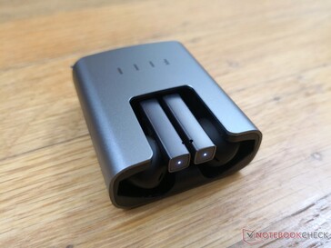 The top of each earbud will flash white when fully charged and blue when attempting to pair
