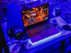 A gaming laptop setup under blue lighting at a demo station, running a game (Image source: Pexels / Bertellifotografia)