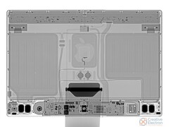 An x-ray of the new iMac, courtesy of iFixit, shows two massive metal plates and tiny internals. (Image via iFixit)