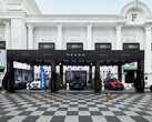 Volvo exhibition booth at Realestate.com.kh Expo 2022, showcasing multiple Volvo cars including SUVs, with promotional banners and branding in front of a grand white building with columns. (Image Source: I'm Zion via Pexels)