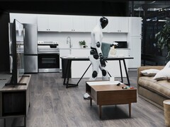 The Figure 03 humanoid robot cleaning up a sitting room