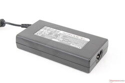 Medium-sized (~13 x 6.8 x 2.7 cm) barrel-type 120 W AC adapter
