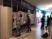 A fire erupted at a Samsung Experience Store in Singapore; workers cordoned off the shop after it was put out. (Source: The Straits Time)