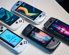 Various handheld gaming PCs on a table