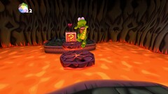 Croc Legend of the Gobbos screenshot showing Croc jumping over lava