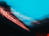 Abstract motion blur of the National Theatre sign in London (Image source: Samuel Regan-Asante via Unsplash)