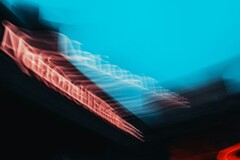 Abstract motion blur of the National Theatre sign in London (Image source: Samuel Regan-Asante via Unsplash)
