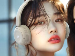 The JVC Kenwood HA-S60W headphones in beige weigh just 149g (5.3 oz.). A young woman wearing the beige model pictured. (Image source: JVC Kenwood)