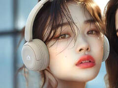 The JVC Kenwood HA-S60W headphones in beige weigh just 149g (5.3 oz.). A young woman wearing the beige model pictured. (Image source: JVC Kenwood)