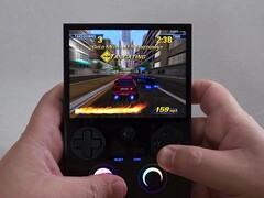 Anbernic RG477V handheld running a racing game during gameplay (Image source: The Phawx via YouTube)