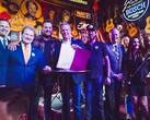 Tennessee Governor Lee hold up the ELVIS act after signing it into law alongside legislators and musicians. (Source: Brandon Hull for The State of Tennessee Office of the Governor)