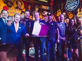 Tennessee Governor Lee hold up the ELVIS act after signing it into law alongside legislators and musicians. (Source: Brandon Hull for The State of Tennessee Office of the Governor)