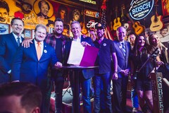 Tennessee Governor Lee hold up the ELVIS act after signing it into law alongside legislators and musicians. (Source: Brandon Hull for The State of Tennessee Office of the Governor)