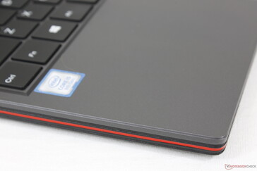 Red trims along the front and side edges add visual flare to an otherwise gray chassis