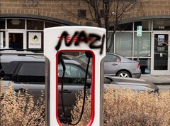 A Tesla Supercharger with graffiti. The automaker has vowed to prosecute vandals (Image source: SnazzyLabs on X)