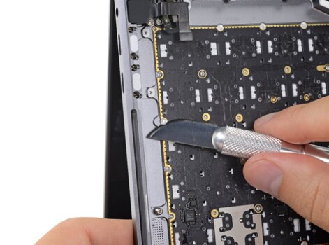 iFixit mentioned that it had to remove "over a dozen" rivets to remove the keyboard in their teardown of the most recent MacBook Butterfly keyboard. Image source: iFixit
