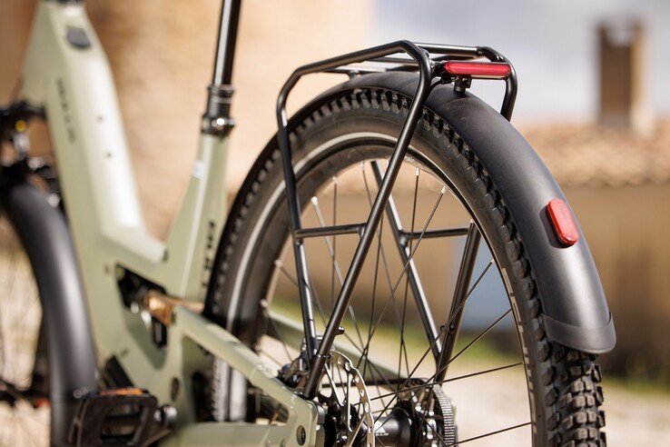 A luggage rack and a lighting system are included with the bike