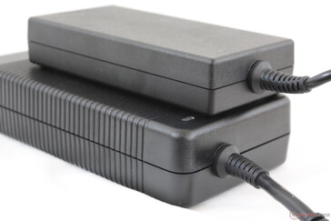Large 330 W AC adapter (bottom) vs. smaller 180 W AC adapter (top)