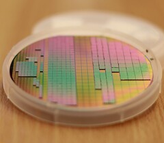 The silicon-interconnect fabric resembles a semiconductor wafer with chips directly placed on it. (Source: IEEE Spectrum)