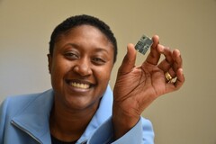 Exec of Intel's Communication and Devices division, Aicha Evans, holds up a modem. (Source: The Motley Fool)