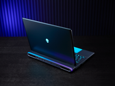 The Alienware 18 Area-51 gaming laptop, pictured on a table against a dimly lit background. (Image source: Dell)