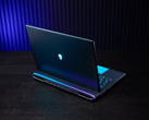 The Alienware 18 Area-51 gaming laptop, pictured on a table against a dimly lit background. (Image source: Dell)