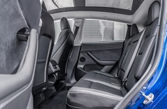 Backseat of a Tesla Model Y. The automaker will bring the child presence detection feature to more models (Image source: MotorTrends)