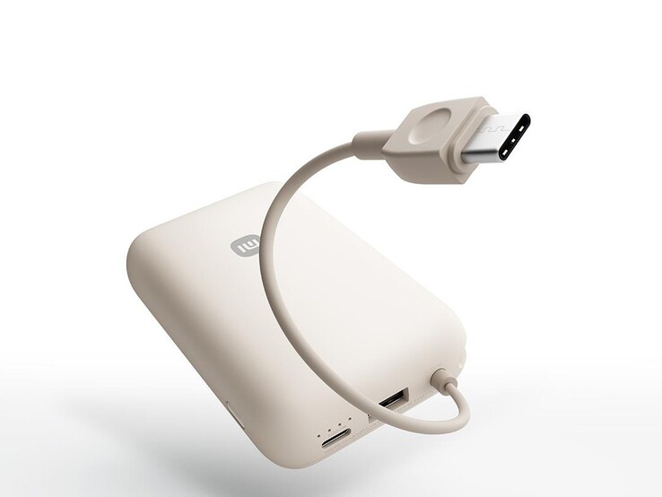 The power bank has a built-in USB-C cable and extra USB-C and USB-A ports