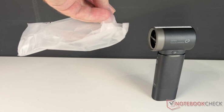 The mini fan produces a good breeze on the third setting, as shown by the fluttering bag.
