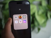 Smartphone showing an app folder named AI with ChatGPT, Mistral AI, Claude, Gemini, Copilot and Poe
