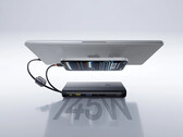 The 145W power bank can recharge 4 devices at the same time. Pictured: a promo picture showing it recharging a phone and a laptop.