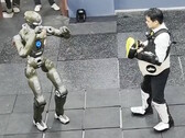 The EngineAI T800 general-purpose robot versus the company CEO Zhao Tongyang. (Image source: EngineAI on X)
