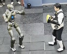 The EngineAI T800 general-purpose robot versus the company CEO Zhao Tongyang. (Image source: EngineAI on X)