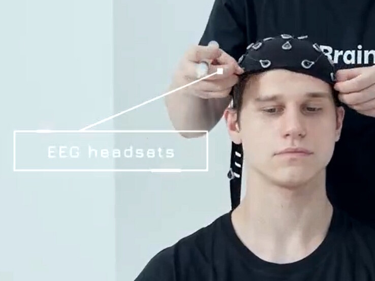 A brain cap reads electrical signals from thoughts to remotely control robots.