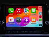 CarPlay home screen with app icons on the touchscreen of a Kia
