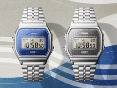 Casio Vintage AE159WEVJ-2 and AE159WEVJ-7 against a blue and muted silver background.