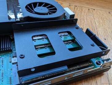 2.5-inch SATA III caddy sits atop the M.2 SSD and RAM slots