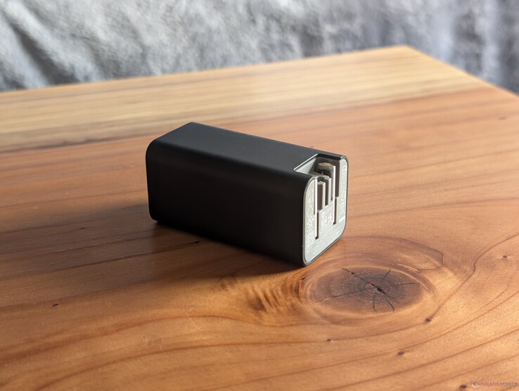 The 65 W USB-C HP adapter has both integrated and retractable AC prongs as well as an open USB-C port on the other end to support nearly any USB-C cable