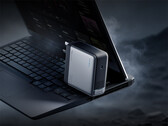 The 360W Cuktech laptop charger comes with a 5525 DC port. Pictured: a promo picture of the adapter with an laptop.  