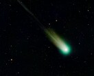 An image showing a comet with a green tail.