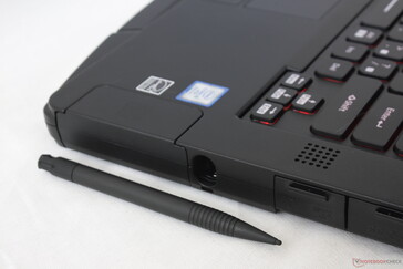 Integrated spring-loaded stylus holder