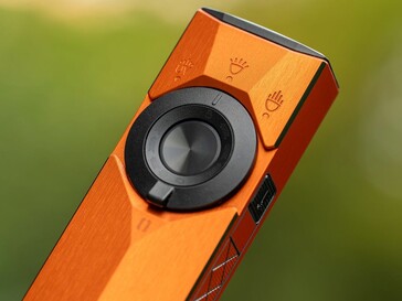 The Olight ArkPro Ultra is controlled by a rotary selector switch located around its power button and a side laser power switch.