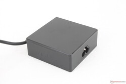 The universal USB-C AC adapter is relatively small (~7.5 x 7.5 x 2.9 cm) considering its 90 W output