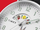 Timex Waterbury Looney Tunes watch shown at an angle, highlighting its polished silver-tone case and white dial with a character disc.