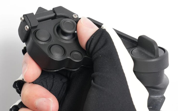 The optional Magnetra2 physical controller with joystick and button inputs is magnetically attached to the ContactGlove2. (Image source: Diver-X)