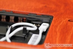 This cavity houses the charging cable for the Apple Watch charger, as well as a hidden USB-A port.