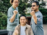 Former Tekken game development leaders Yonemori Ikeda and Harada raising their fists for a photo