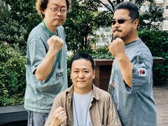 Former Tekken game development leaders Yonemori Ikeda and Harada raising their fists for a photo