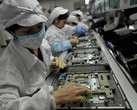 Workers at a Foxconn factory in Shenzhen, China. (Source: AFP/AFP/Getty Images)
